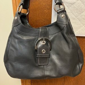 Coach black leather medium sized handbag with buckle
